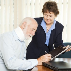 Personal injury lawyer signs up a new injured client.